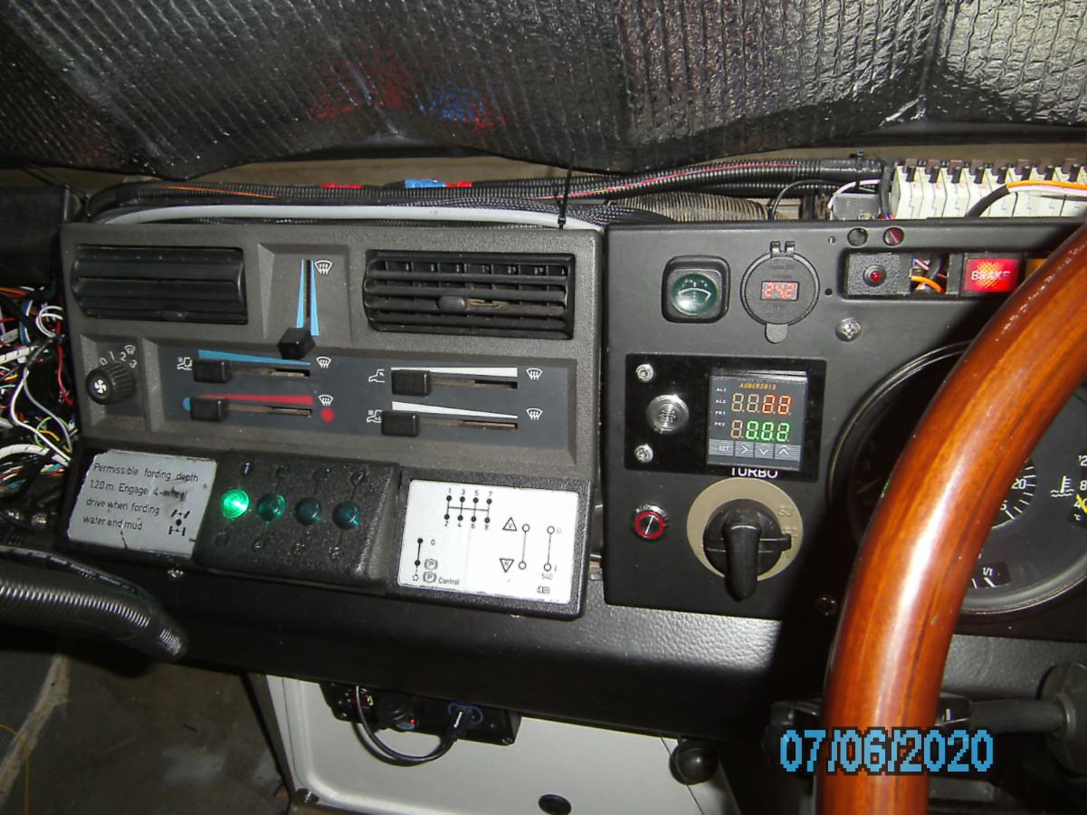The gear selector green light and Turbo monitor are shown